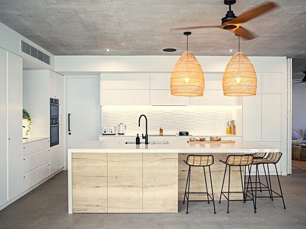 A finished kitchen with pendant lighting after a renovation rewire