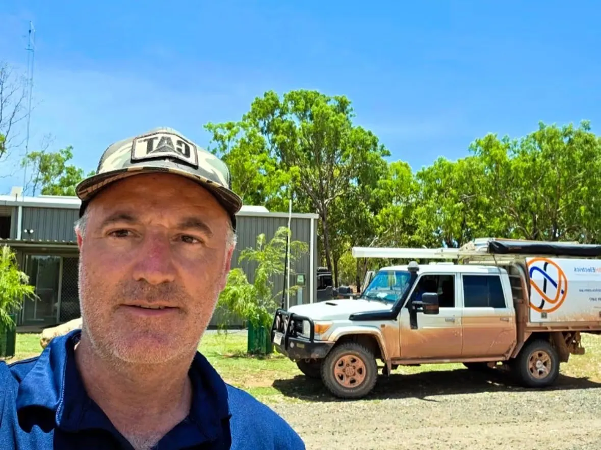 Brad Sims on a remote Far North Queensland job, the mud-covered BH Electrics four wheel drive parked behind him