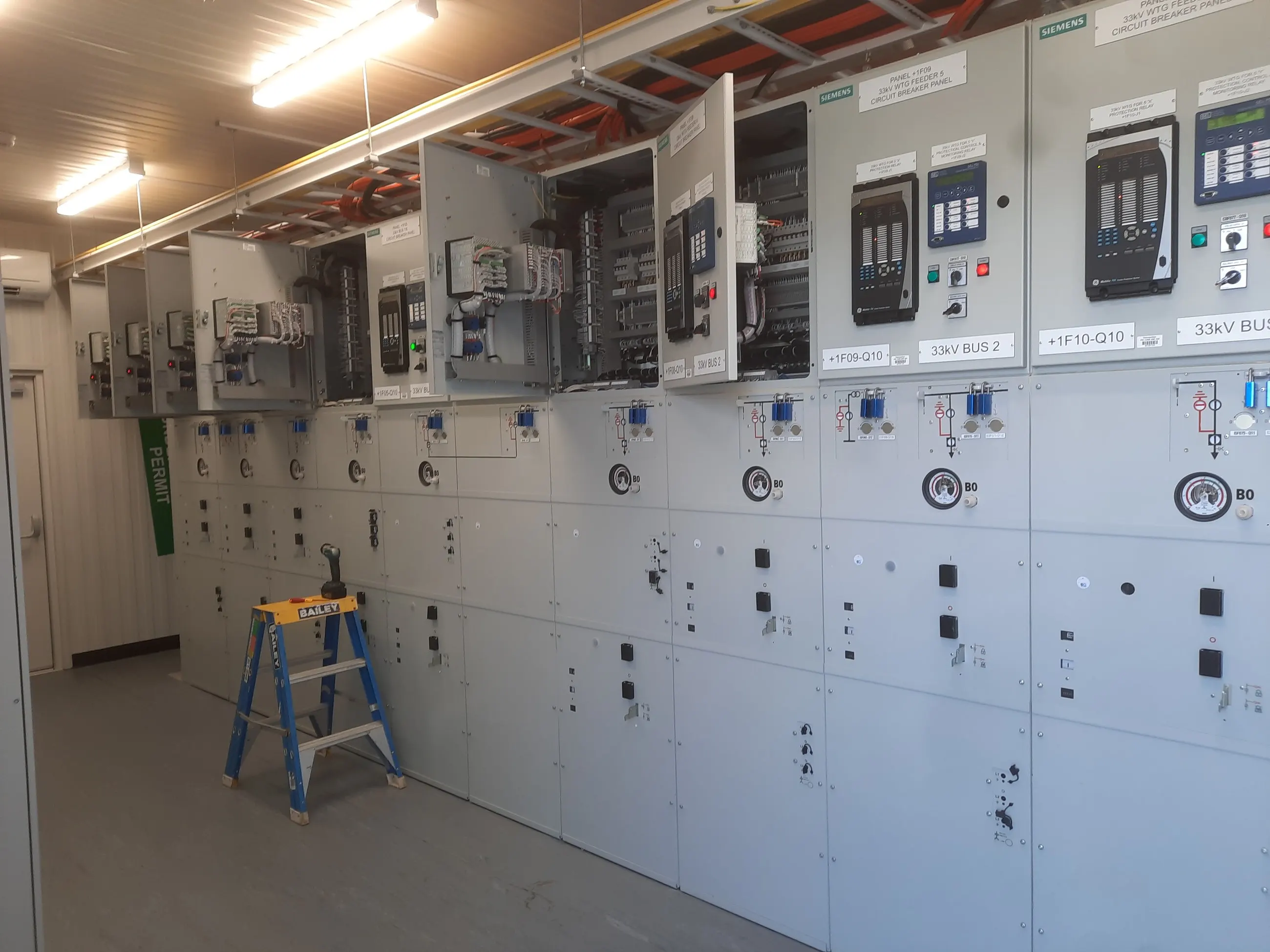 A 33kV switchroom on Mount Emerald Wind Farm, Siemens turbine feeder panels open for commissioning