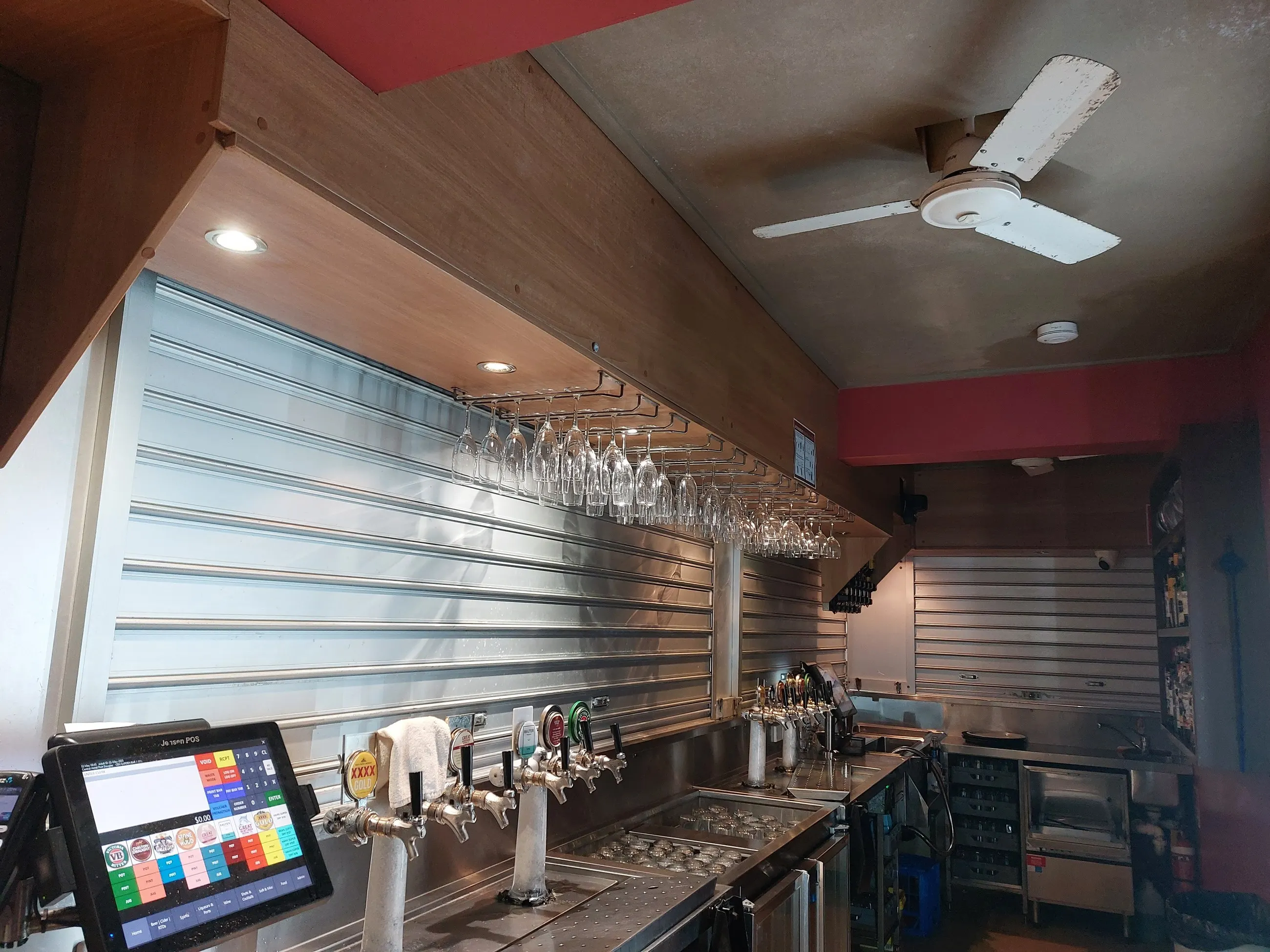 A finished bar fit-out in Port Douglas, lit and ready to open