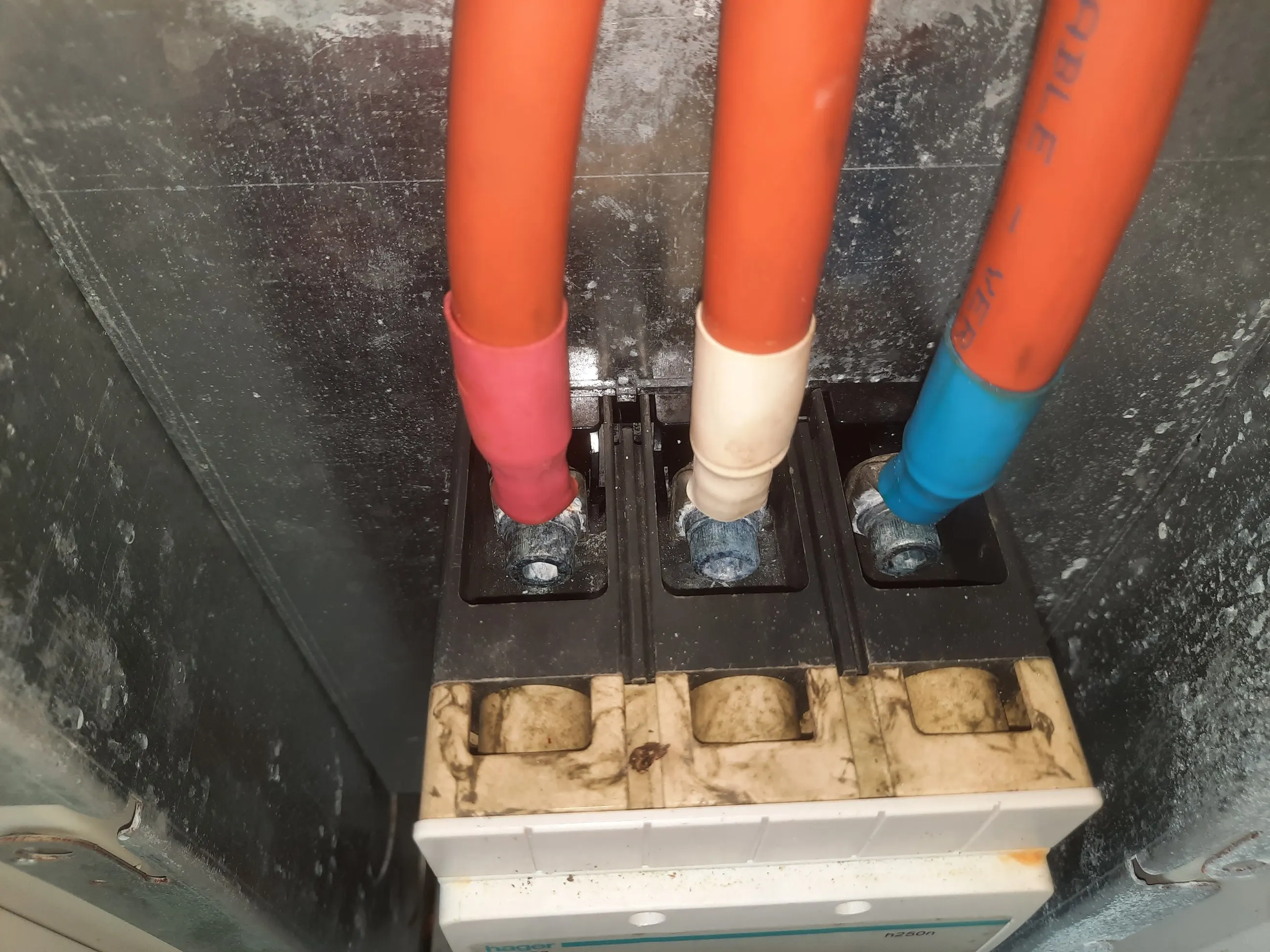 Busbar terminations in a commercial switchboard, torqued and labelled