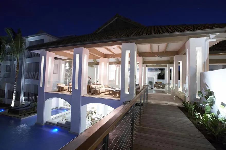 A lit poolside walkway and lounge area at Peppers Beach Club, Port Douglas, after dark, during the resort refurbishment